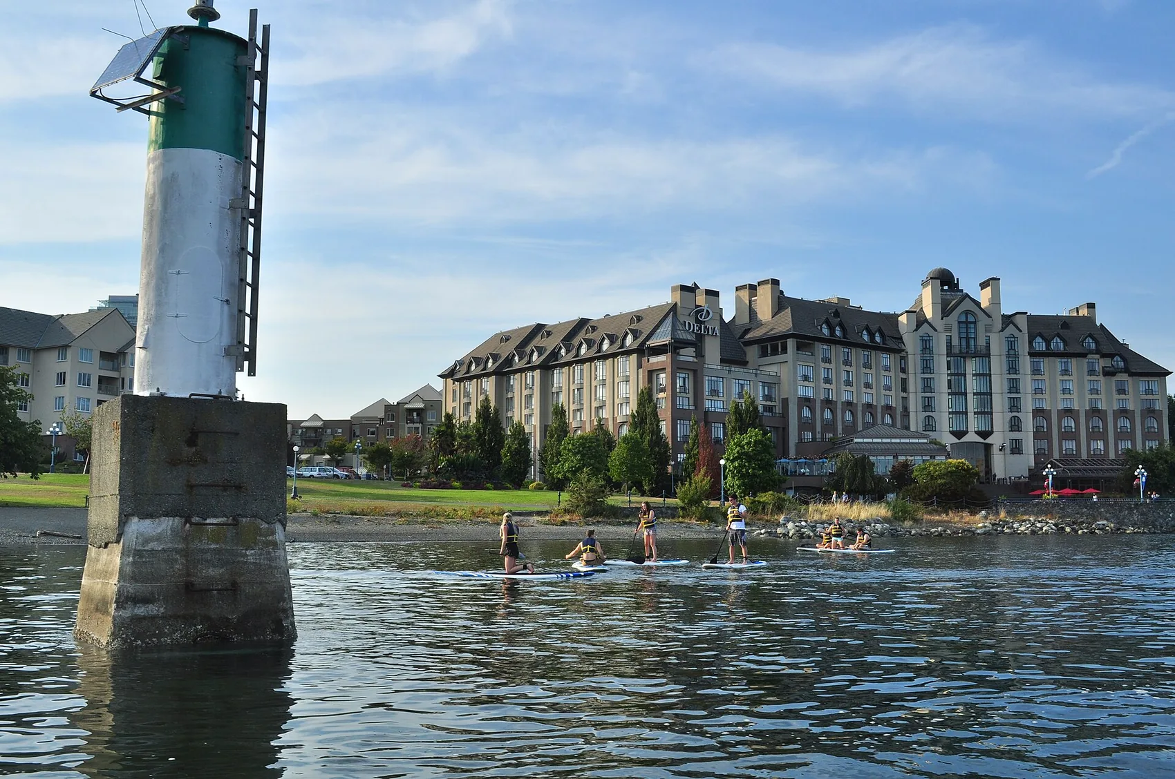 Stand-up paddling on a calm morning bay